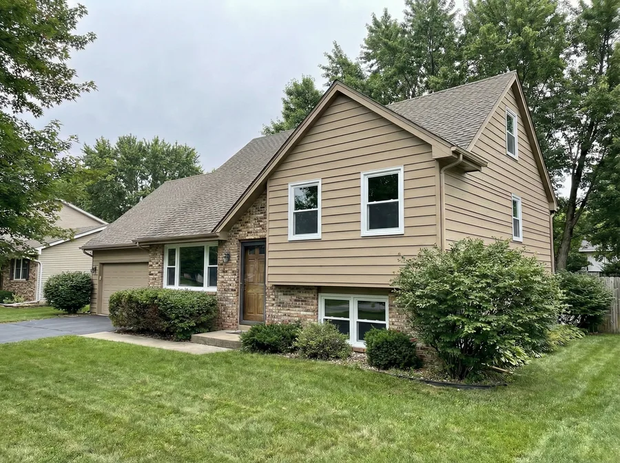 After: same home with new double-pane vinyl windows
