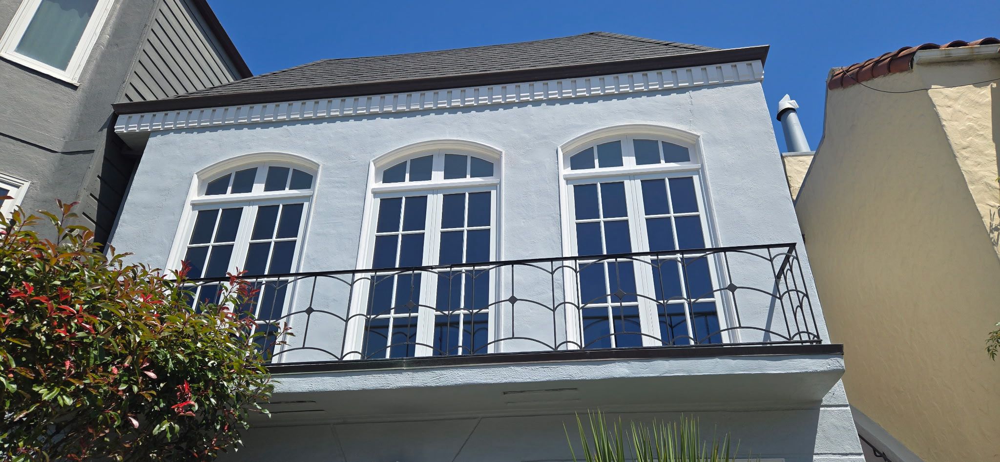 Arched window replacement on stucco home, East Bay