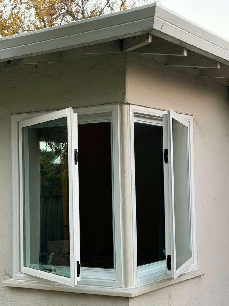 Corner casement windows installed on stucco home, East Bay