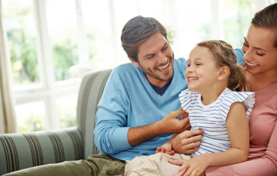 Family in a bright living room with Anlin Catalina windows