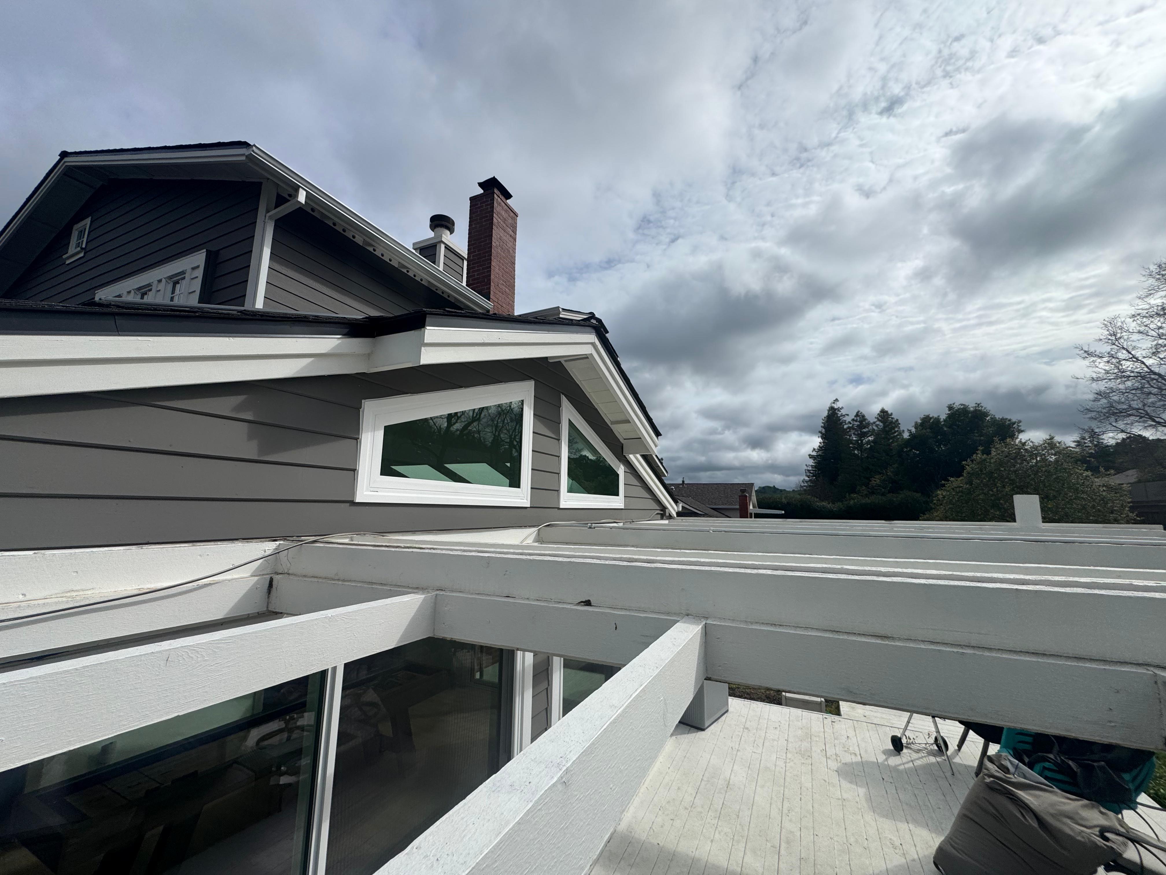 Clerestory awning windows installed along roofline, East Bay