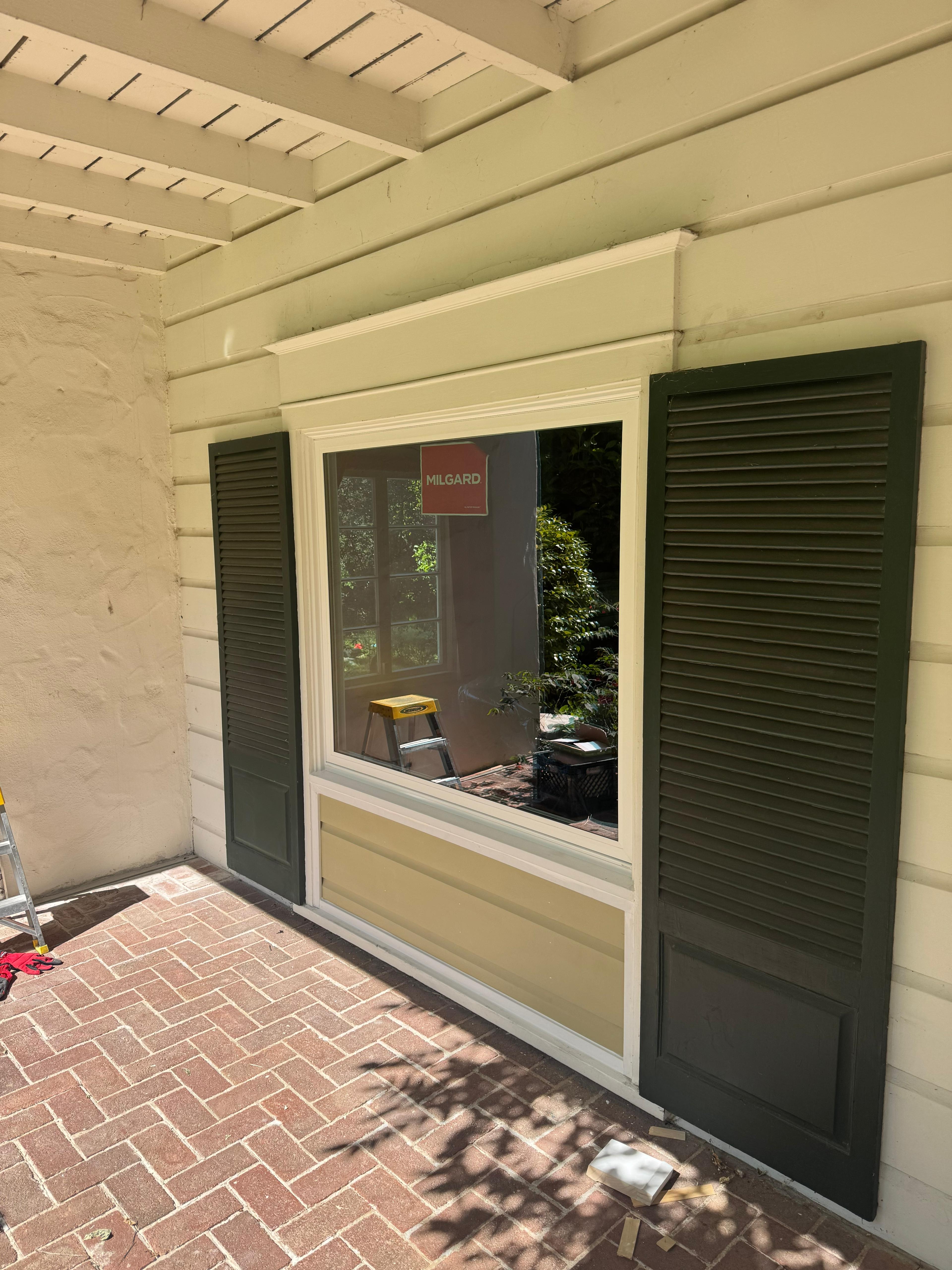 Picture window with dark shutters installed by Windows 4U