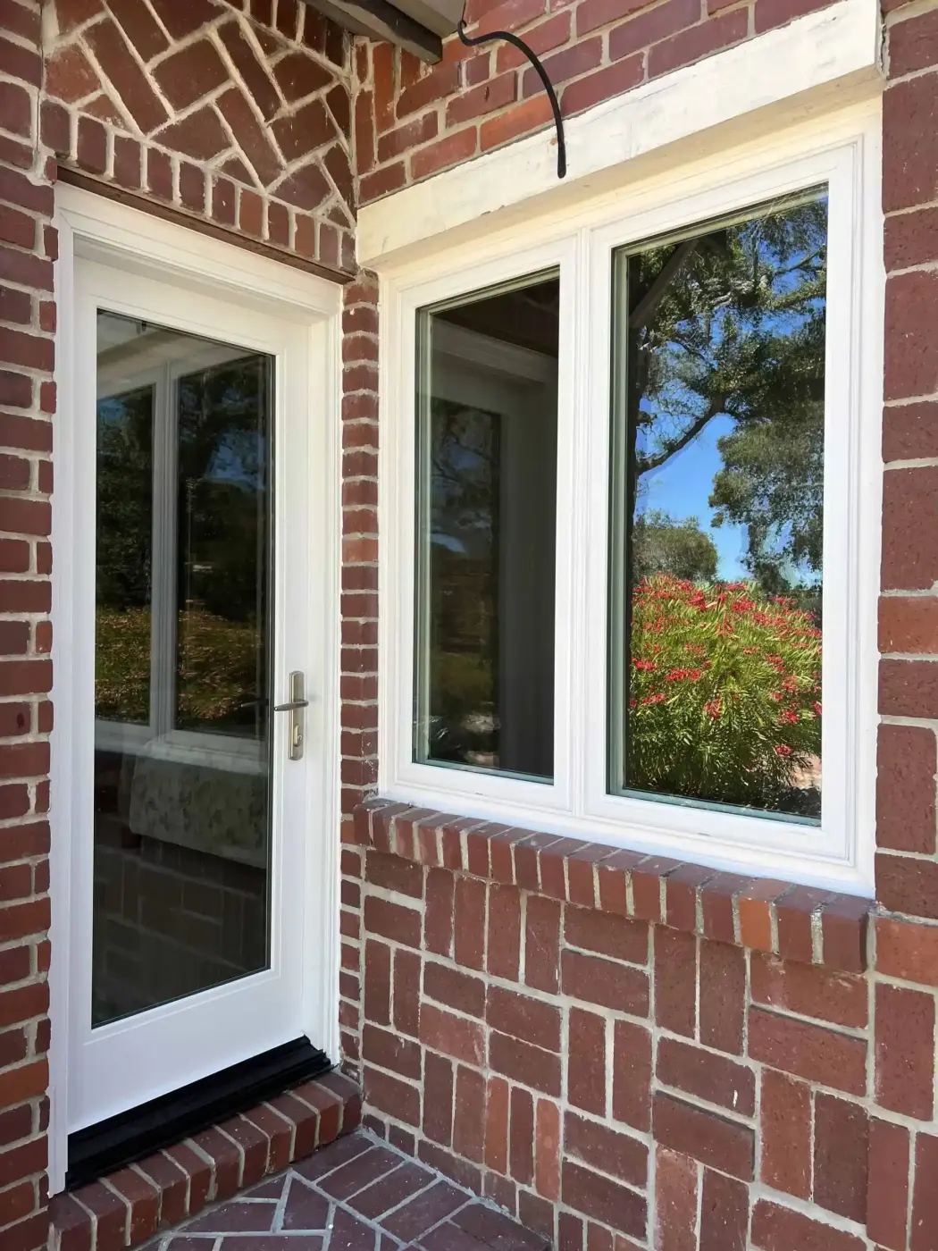 New casement windows on a brick home, installed by Windows 4U