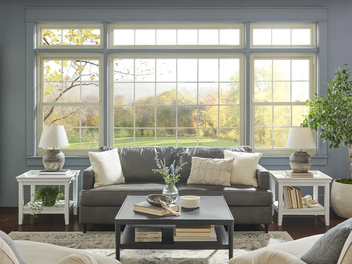 Living room with white vinyl double-hung windows