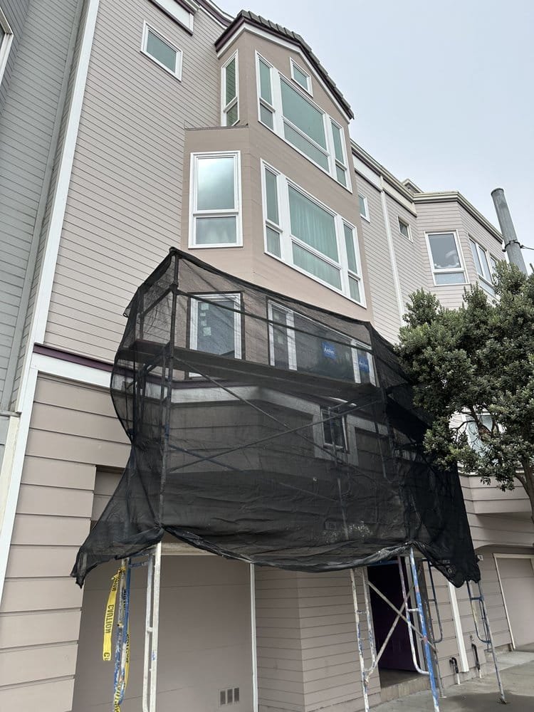 Multi-story residential building window replacement with scaffolding, Bay Area