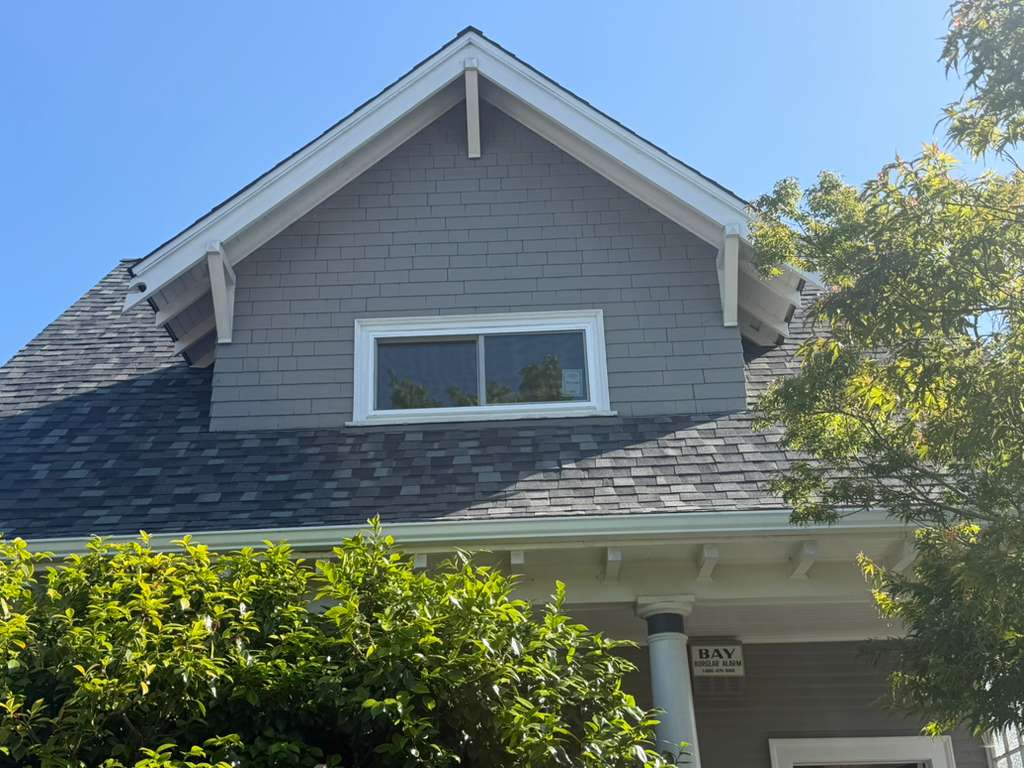 Wide horizontal slider window on craftsman gable home, East Bay