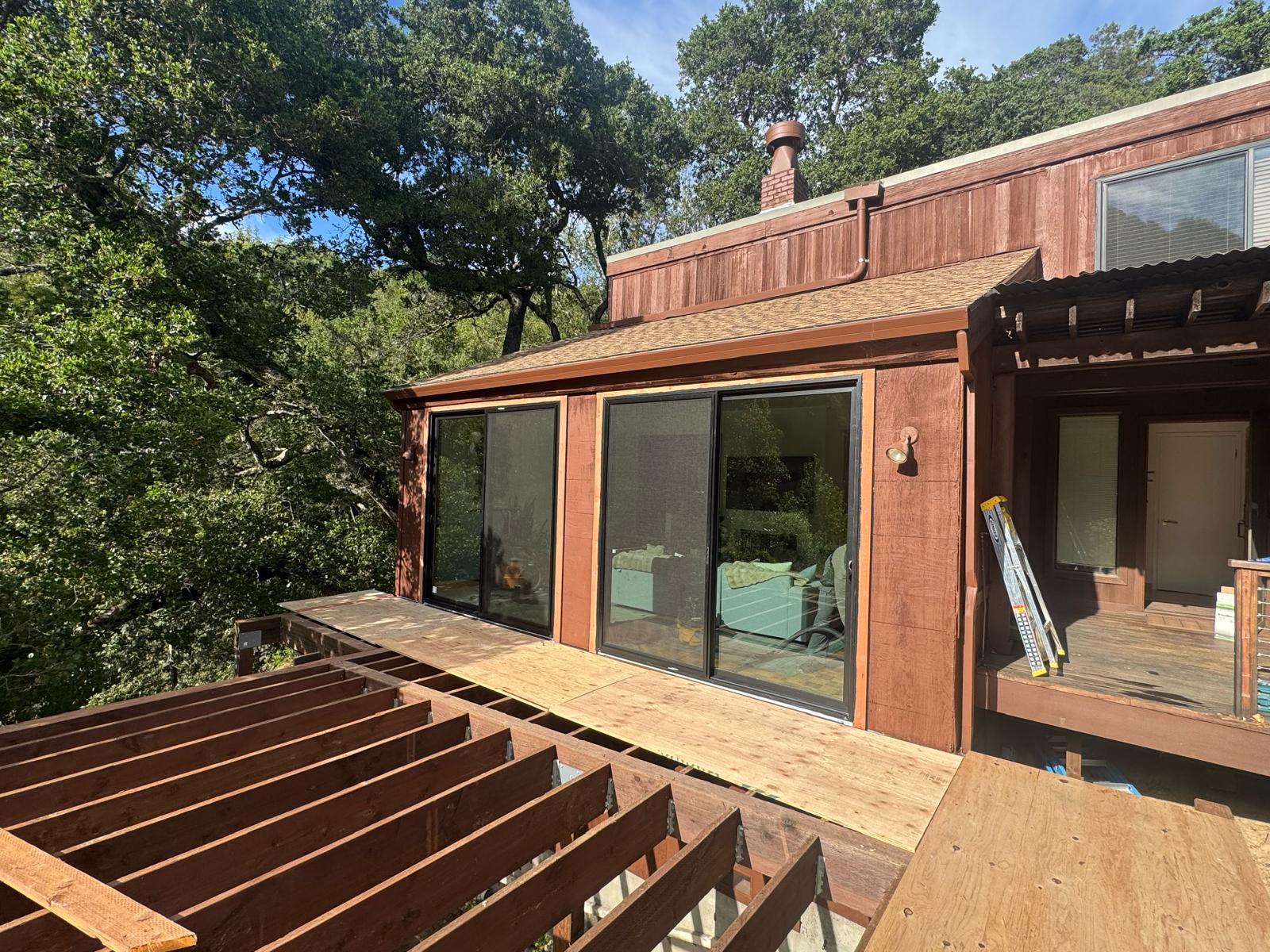 Aluminum sliding glass door on wood deck, East Bay