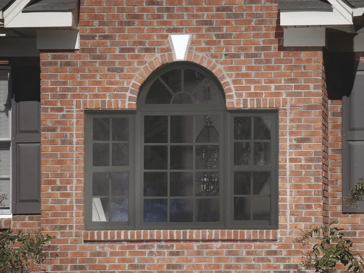 Arched window in a brick wall